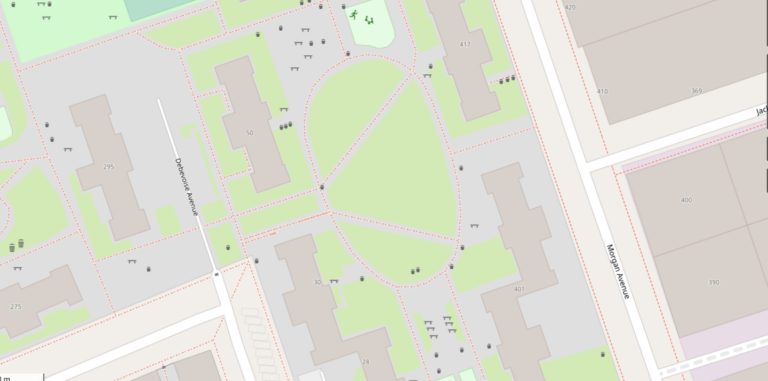A digital map of a housing complex in Brooklyn in light green, grey and different shades of white. Small black spots marking different amenities are spread throughout the map.