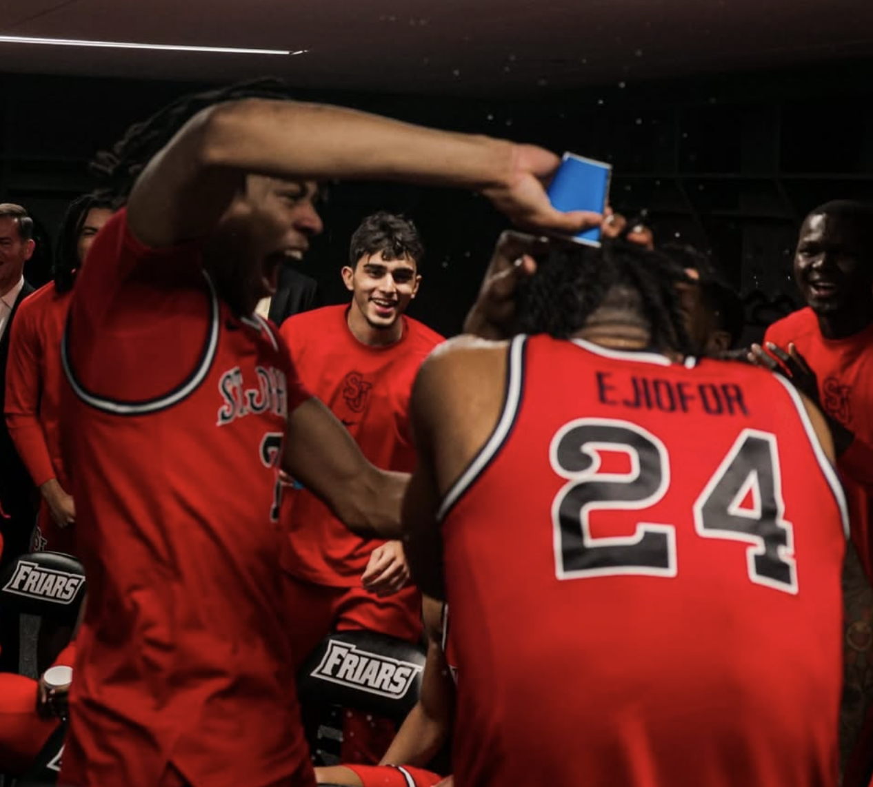 Zuby Ejiofor has water poured on him in the locker room